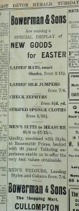 A photo of a page from all old newspaper advertising Bowerman & Sons, based in 'The Shopping Mart, Cullompton'. The text reads: ' Bowerman & SOns are making a special display of New Goods for Easter', It goes on to detail some of the goods on offer, including 'Ladies' Hats, Ladies' Silk Jumpers, Check Zephyrs, Striped Sponge Cloths and Men's (sic) Suits to Measure'.