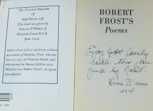 A book of Robert Frost's poems with an inscription reading 'Robert Frost was a direct descendant of Nicholas Frost who was born in Tiverton, Devon in 1592.