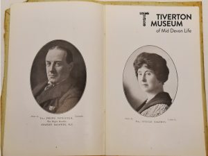 A photograph showing a page of a book which features a photograph of Stanley Baldwin and on of his wife.