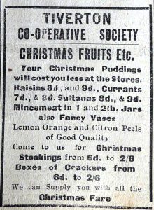 Newspaper advert for Tiverton Co-Operative Society Christmas Fruits etc suggesting that they are cheaper than International Stores. 